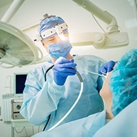 Oral surgeon performing nasal surgery