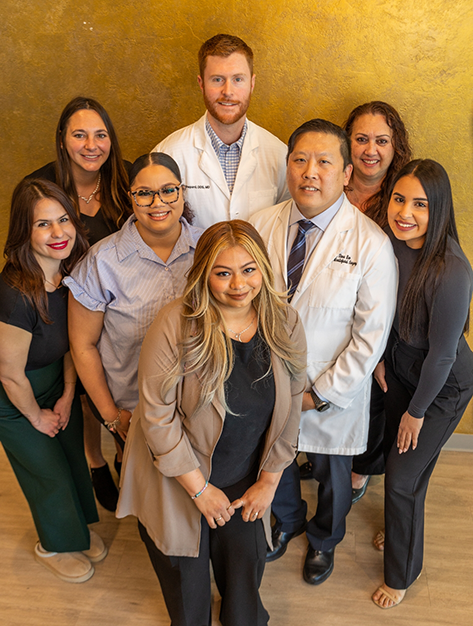 Smiling oral surgeons and team members at Piney Point Oral and Maxillofacial Surgery of Houston