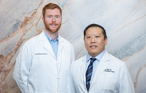 Doctor Steve Koo and Doctor William Shepard in white lab coats