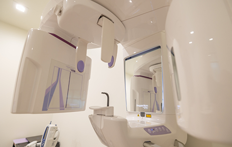 CT machine standing against a wall