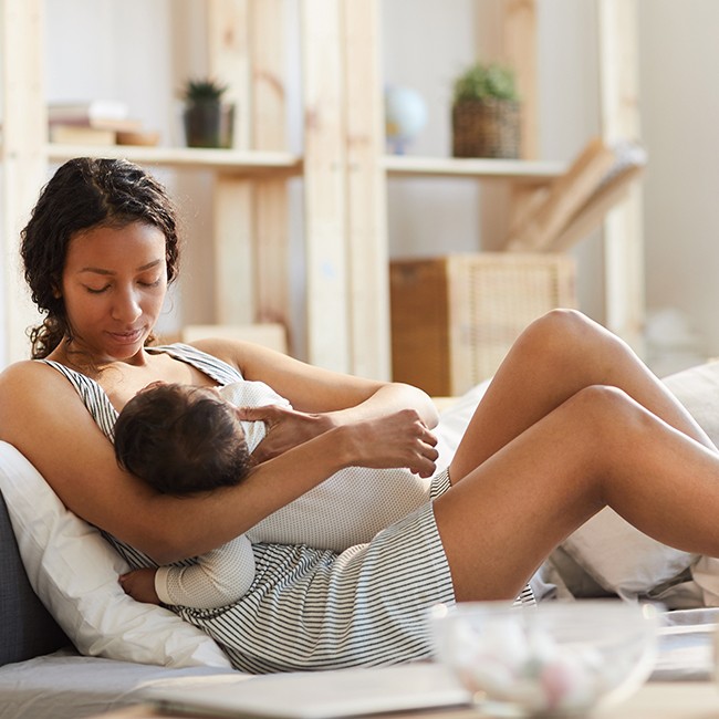 Mother holding sleeping baby