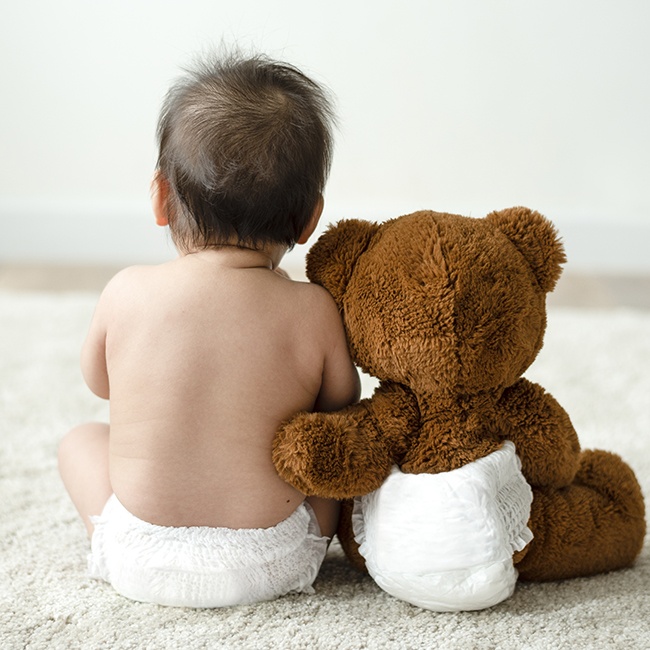 Baby and teddy bear