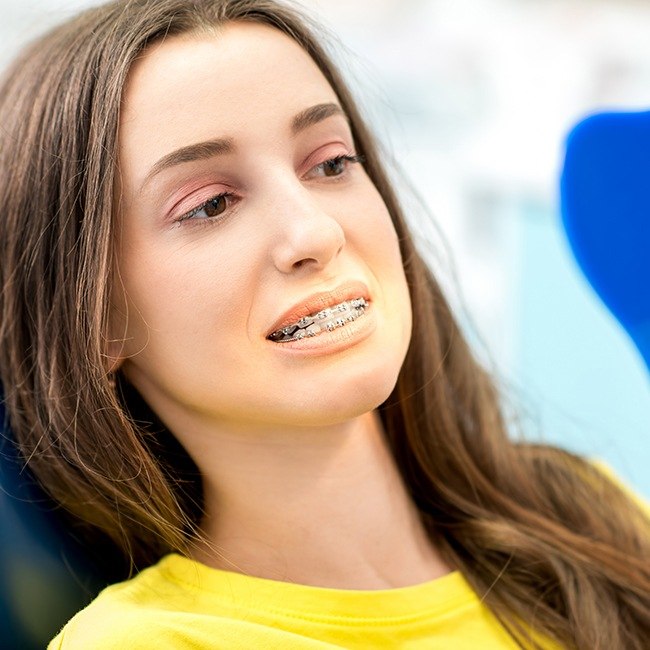 Woman looking rather smile after tooth replacement