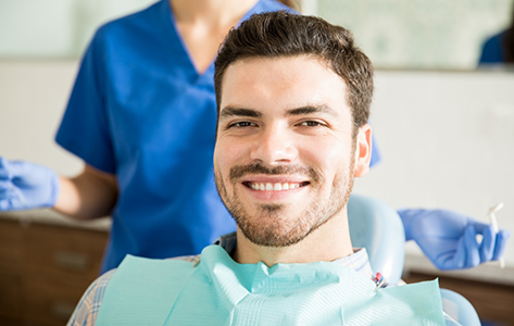 Smiling man in the dental chair