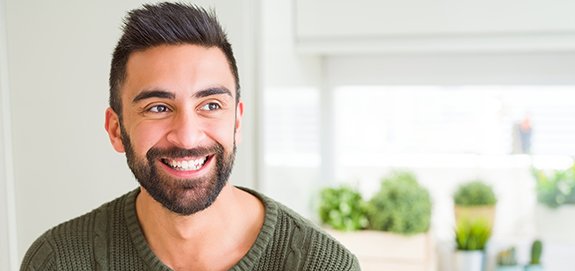 Man sharing smile after dental implant tooth replacement