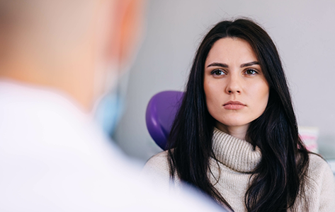 Woman listening to her oral surgeon
