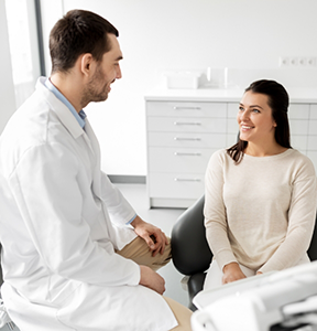 Smiling woman listening to her dentist