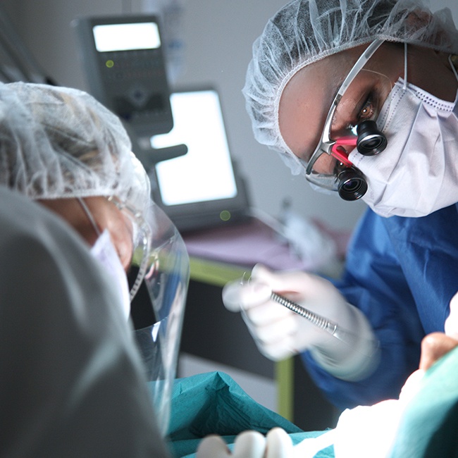 Oral surgeon performing facial trauma treatment