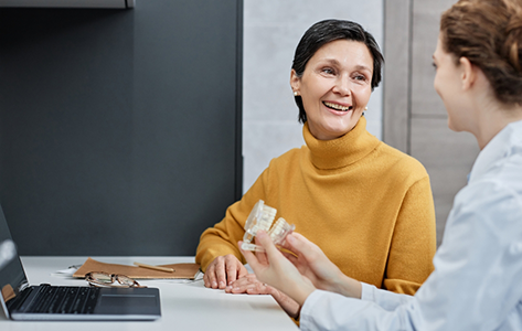 Woman at an implant denture consultation