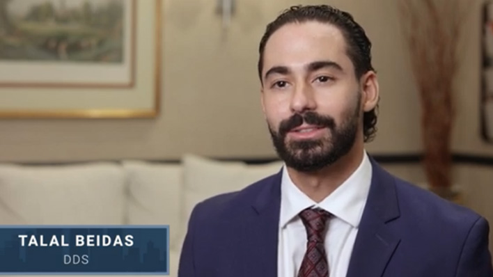 Two oral surgeons walking down a hallway