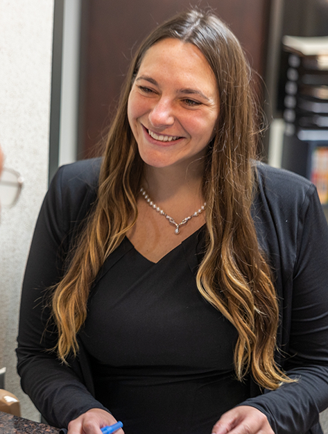 Houston oral surgery team member smiling at a patient