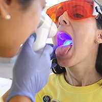 Closeup of patient getting an oral cancer screening in Houston