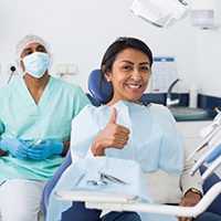 Woman gives thumbs up before oral cancer treatment in Houston