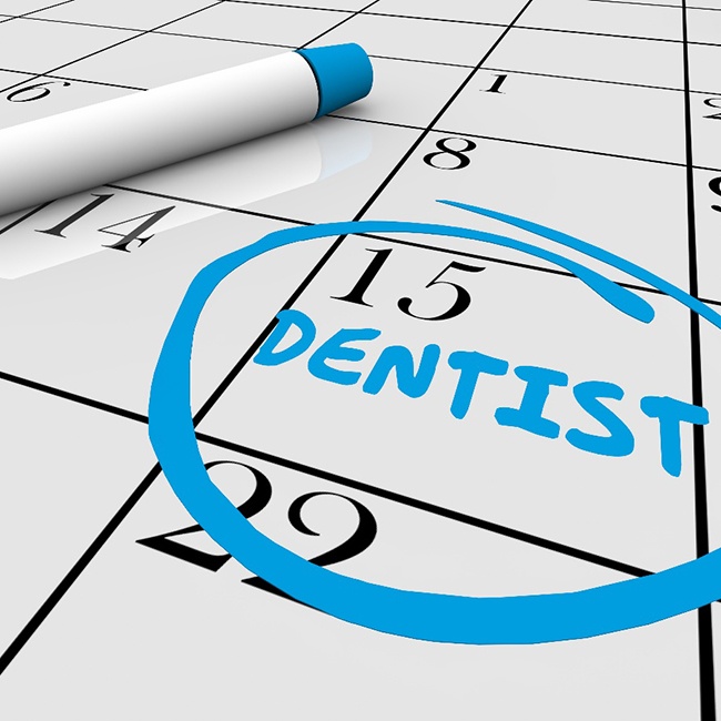 Calendar with dentist circled to help prevent oral caner in Houston