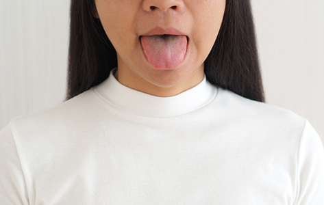 Woman sticking out her tongue