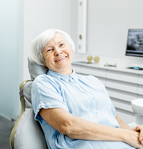Senior woman smiling in the dental chair
