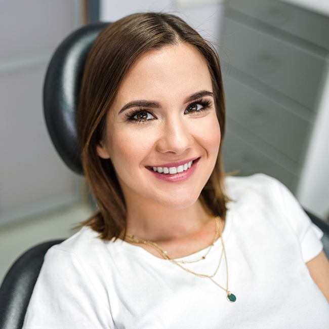 Woman talking to oral surgeon about orthognathic surgery procedure