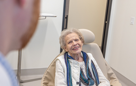 Senior woman smiling in the treatment chair