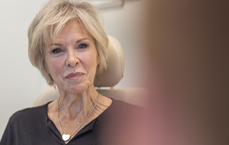 Older patient listening to her oral surgeon