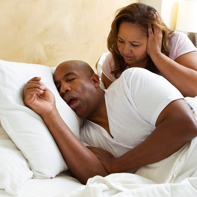 Woman frustrated with snoring man