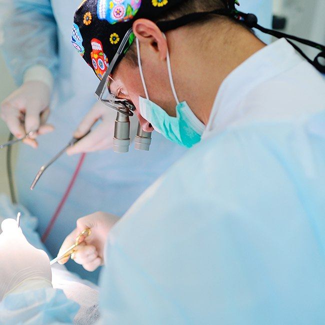 Oral surgeon performing surgical sleep apnea treatment