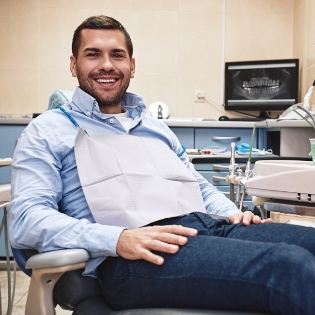 Man smiling on the day of his wisdom tooth extraction