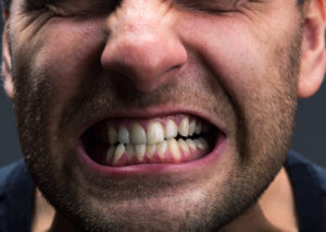 Man grinding teeth