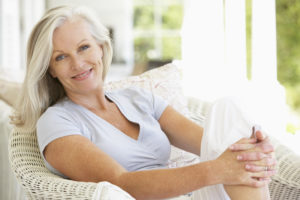 older woman on a sunlit porch