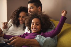 family smiling in an embrace