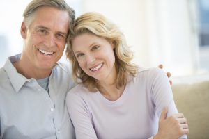 man and woman smiling at home