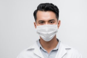 oral surgeon wearing white ASTM medial face mask