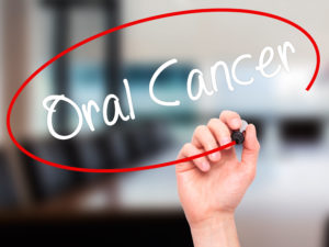 "Oral cancer" in white lettering, circled by red