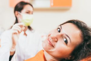 Patient smiling after learning truth behind myths about tooth extraction