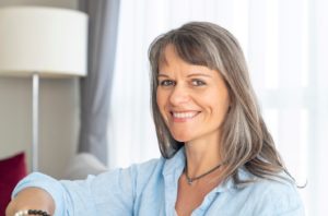Portrait of smiling woman after successful All-on-4 recovery