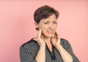 Woman experiencing TMJ pain