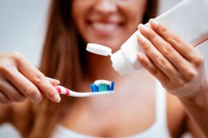 Woman preparing to brush her teeth 