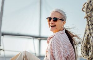 Smiling older woman enjoying time outdoors 